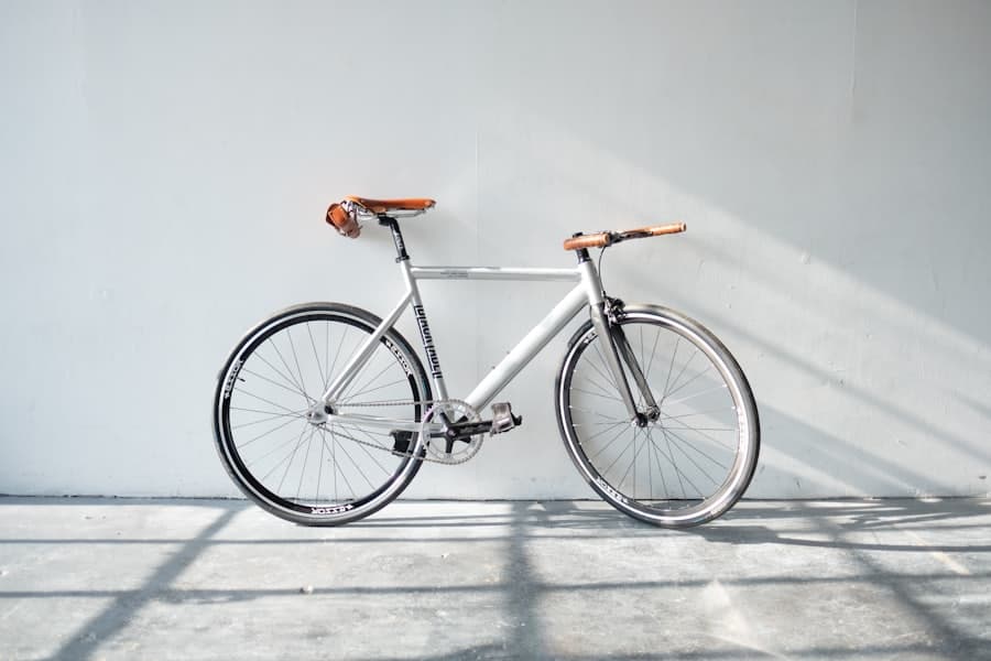 A bicycle against a pale wall in morning light